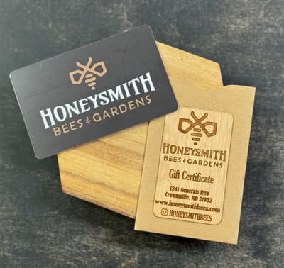 Honeysmith gift card resting on a wooden table